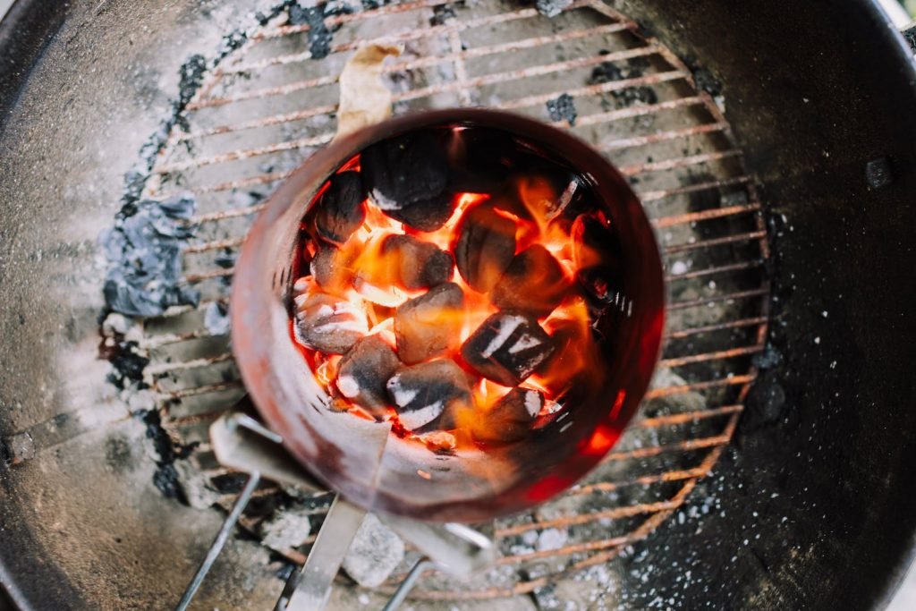 Charcoal Briquettes Burning on a Grill